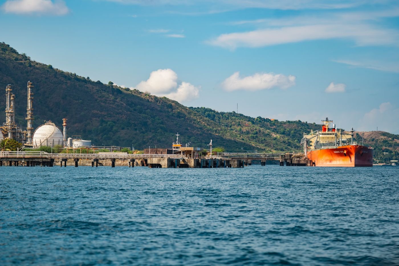 An oil tanker berthed at a deep-water jetty in the port